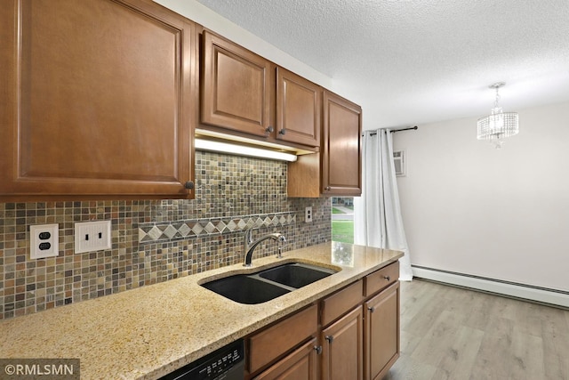 2800 Hillsboro Ave N Unit 108, New Hope, MN 55427 - kitchen with a sink, baseboard heating, light wood finished floors, light stone countertops, and tasteful backsplash