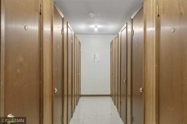 2800 Hillsboro Ave N Unit 108, New Hope, MN 55427 - corridor with a textured ceiling and baseboards