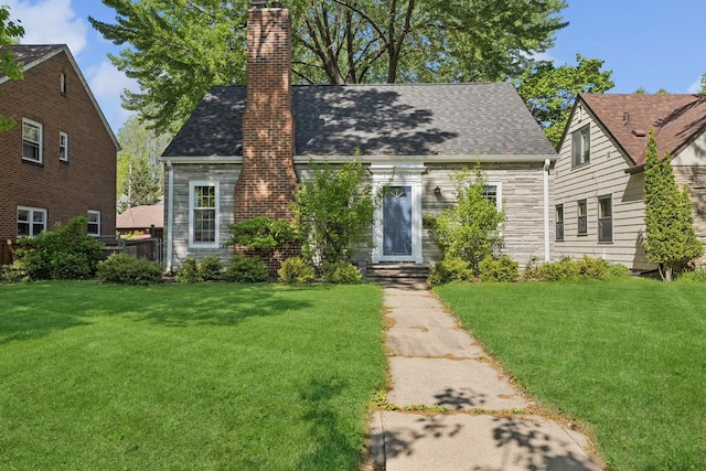 5604 14th Ave S, Minneapolis, MN 55417 - cape cod-style house with a chimney, a shingled roof, and stone siding