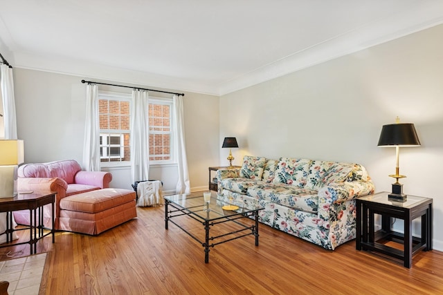 5604 14th Ave S, Minneapolis, MN 55417 - living room featuring wood finished floors, ornamental molding, and baseboards