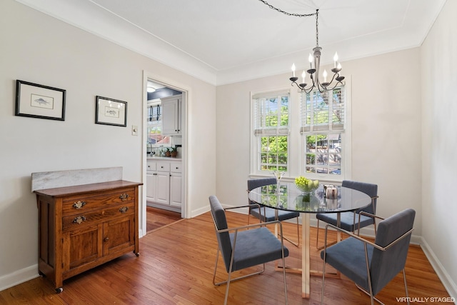 5604 14th Ave S, Minneapolis, MN 55417 - dining room with a chandelier, light wood finished floors, and baseboards
