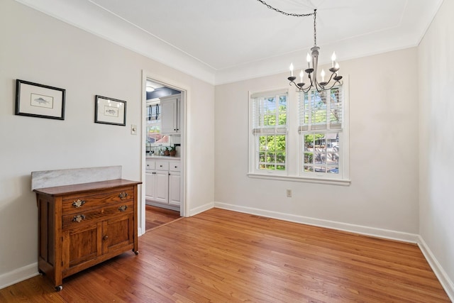 5604 14th Ave S, Minneapolis, MN 55417 - dining area with a chandelier, light wood-type flooring, and baseboards