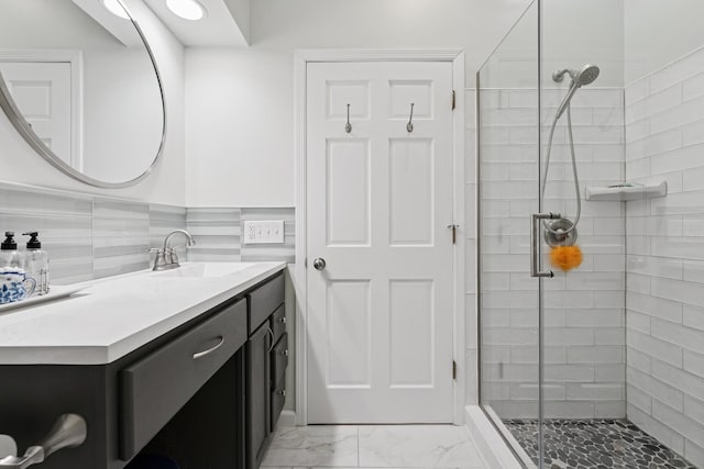 5604 14th Ave S, Minneapolis, MN 55417 - full bathroom featuring a shower stall, vanity, and marble look tiles