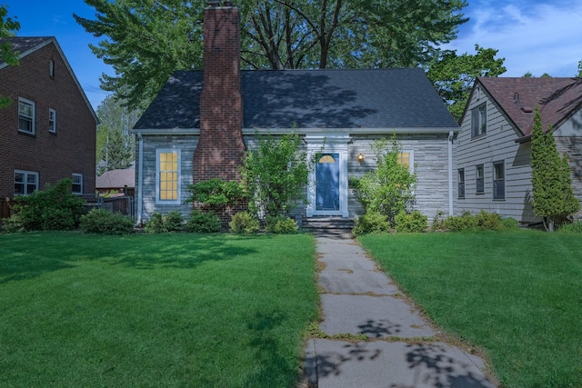 5604 14th Ave S, Minneapolis, MN 55417 - view of front of property featuring a chimney, a front lawn, and roof with shingles