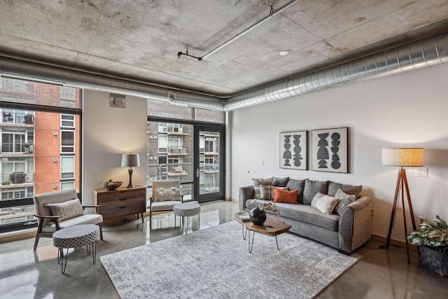 720 4th St Unit 603, Minneapolis, MN 55401 - living area featuring finished concrete flooring and baseboards