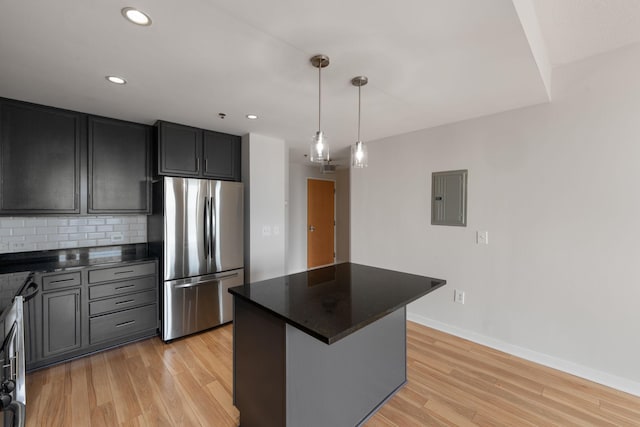 929 Portland Ave Unit 907, Minneapolis, MN 55404 - kitchen featuring freestanding refrigerator, electric panel, light wood-type flooring, backsplash, and recessed lighting