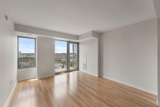 929 Portland Ave Unit 907, Minneapolis, MN 55404 - empty room with light wood finished floors and baseboards