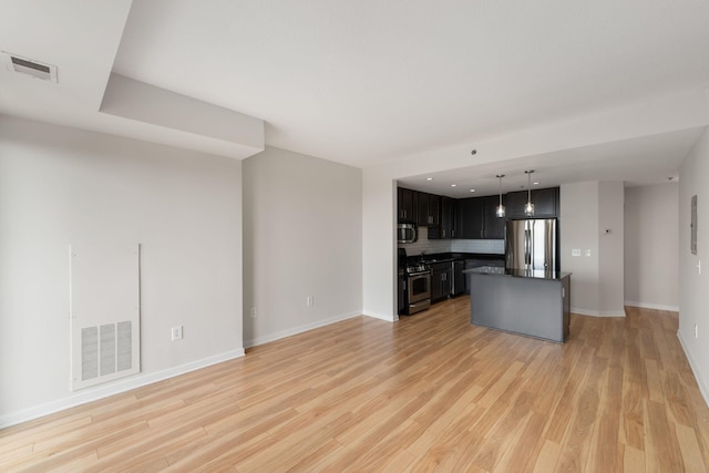 929 Portland Ave Unit 907, Minneapolis, MN 55404 - unfurnished living room featuring light wood-type flooring and recessed lighting