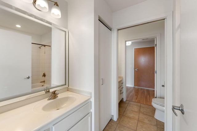 929 Portland Ave Unit 907, Minneapolis, MN 55404 - bathroom featuring vanity, tile patterned floors, and washtub / shower combination