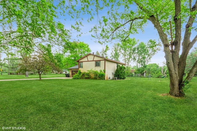 17551 London St NE, Ham Lake, MN 55304 - view of property exterior featuring a lawn and stucco siding