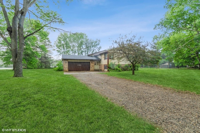 17551 London St NE, Ham Lake, MN 55304 - split level home featuring dirt driveway, an attached garage, and a front lawn