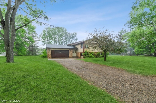 17551 London St NE, Ham Lake, MN 55304 - split level home with driveway, an attached garage, and a front yard