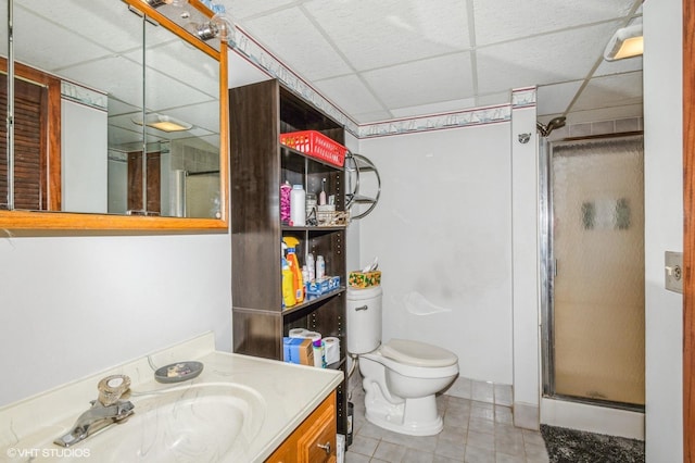 17551 London St NE, Ham Lake, MN 55304 - full bathroom featuring a paneled ceiling, tile patterned floors, vanity, toilet, and a shower stall