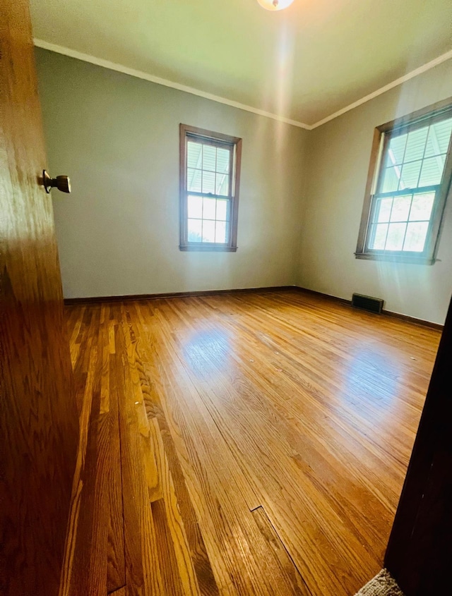 150 Park St W, South Saint Paul, MN 55075 - unfurnished room featuring crown molding, wood finished floors, and baseboards