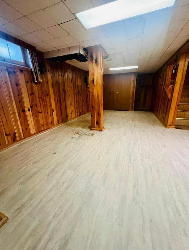 150 Park St W, South Saint Paul, MN 55075 - below grade area with wooden walls, light wood-style floors, and stairway