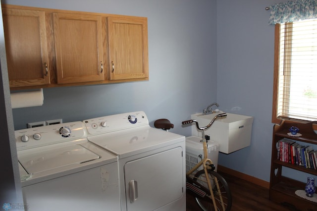3441 25th St S, Moorhead, MN 56560 - laundry area with separate washer and dryer, cabinet space, healthy amount of natural light, and dark wood-type flooring