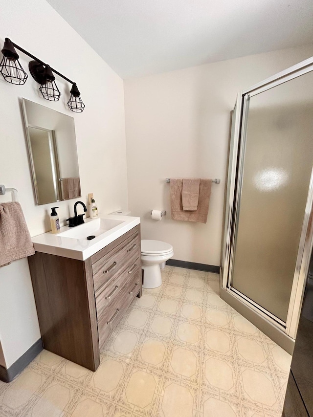 2145 Big Deep Lake Dr NW, Hackensack, MN 56452 - full bathroom with vanity, a stall shower, baseboards, and toilet