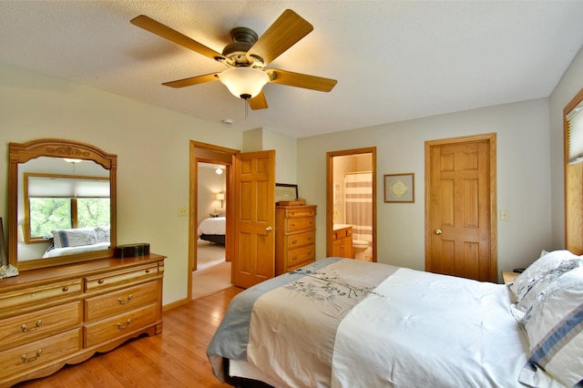 1518 4th Ave N, Sartell, MN 56377 - bedroom with light wood-type flooring, ensuite bathroom, and ceiling fan