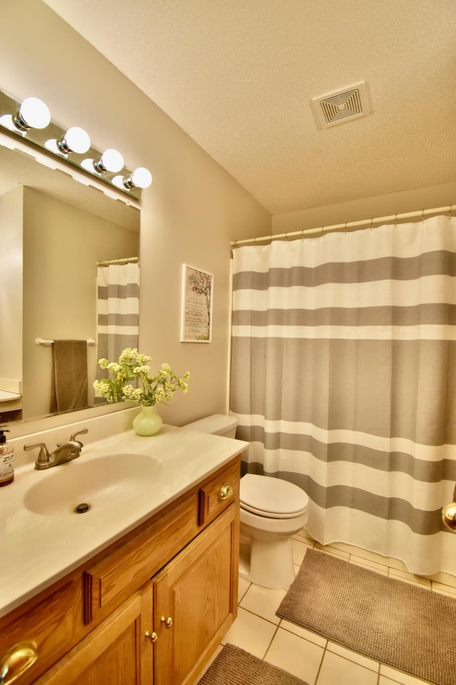 1518 4th Ave N, Sartell, MN 56377 - full bathroom with vanity, tile patterned floors, toilet, and a textured ceiling