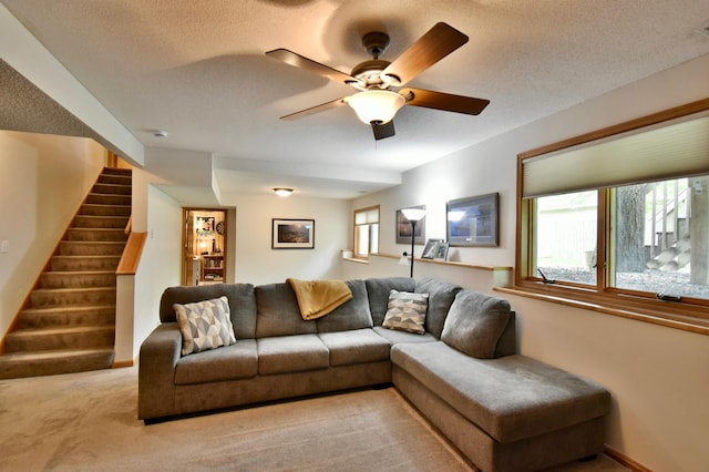 1518 4th Ave N, Sartell, MN 56377 - carpeted living area featuring stairway, a ceiling fan, a textured ceiling, and baseboards