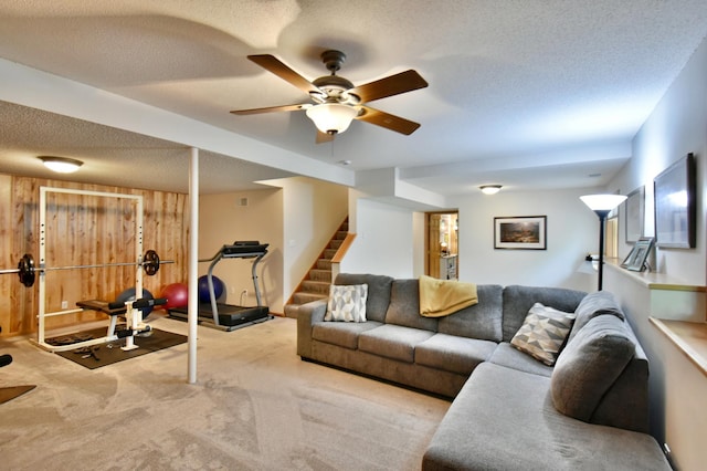 1518 4th Ave N, Sartell, MN 56377 - living area with stairway, carpet flooring, a textured ceiling, and a ceiling fan