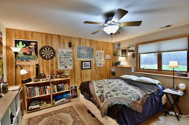 1518 4th Ave N, Sartell, MN 56377 - carpeted bedroom with wood walls and ceiling fan