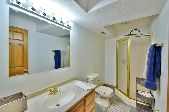 1518 4th Ave N, Sartell, MN 56377 - bathroom featuring a shower stall, toilet, vanity, tile patterned floors, and a textured ceiling