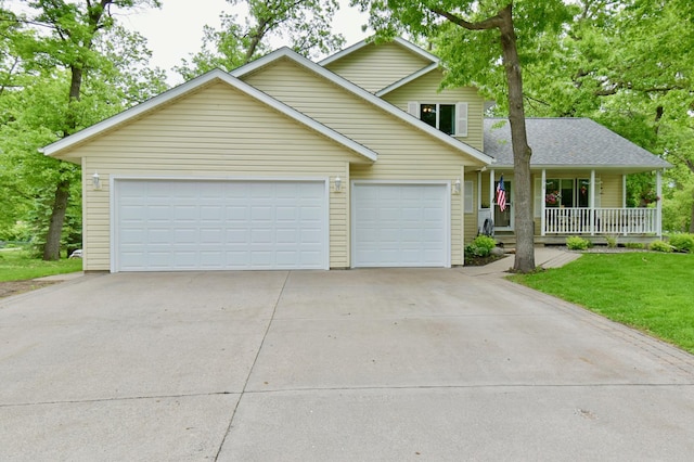 1518 4th Ave N, Sartell, MN 56377 - traditional-style house with a porch, concrete driveway, and an attached garage
