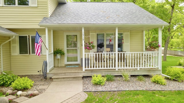 1518 4th Ave N, Sartell, MN 56377 - view of exterior entry with covered porch and roof with shingles