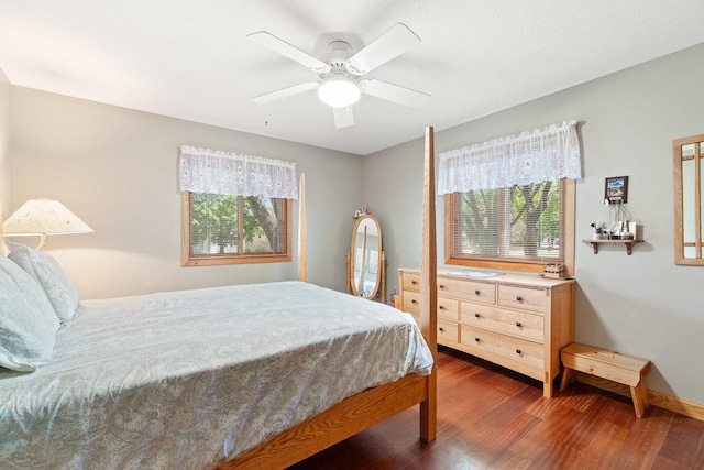 903 Ingalls Rd, Menomonie, WI 54751 - bedroom with multiple windows, wood finished floors, and a ceiling fan