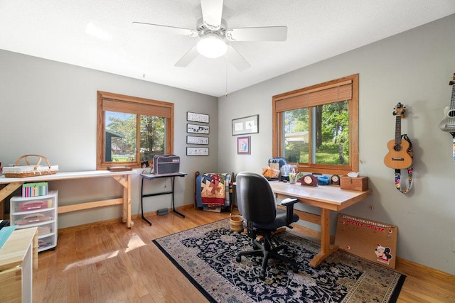 903 Ingalls Rd, Menomonie, WI 54751 - office with plenty of natural light, light wood finished floors, ceiling fan, and baseboards