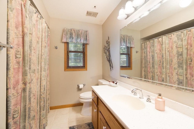 903 Ingalls Rd, Menomonie, WI 54751 - full bath with toilet, vanity, tile patterned flooring, and baseboards