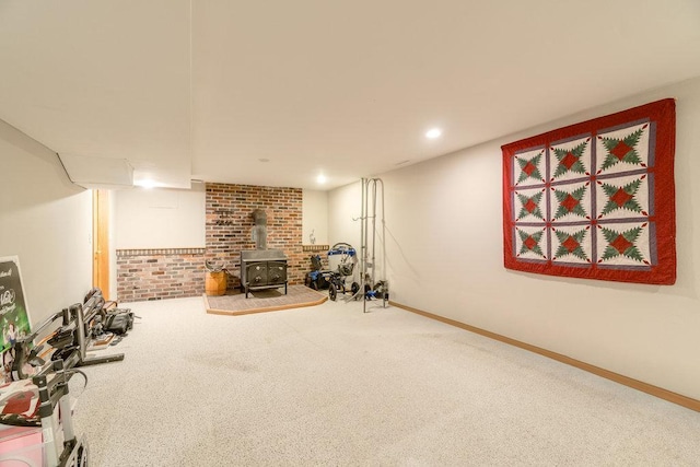 903 Ingalls Rd, Menomonie, WI 54751 - finished below grade area with a wood stove, carpet floors, and baseboards