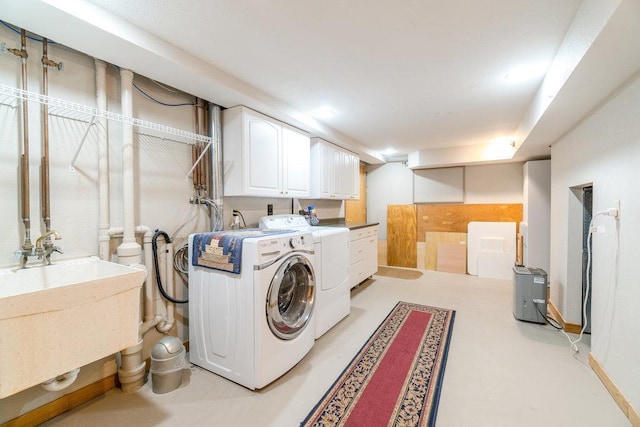 903 Ingalls Rd, Menomonie, WI 54751 - washroom featuring cabinet space and separate washer and dryer