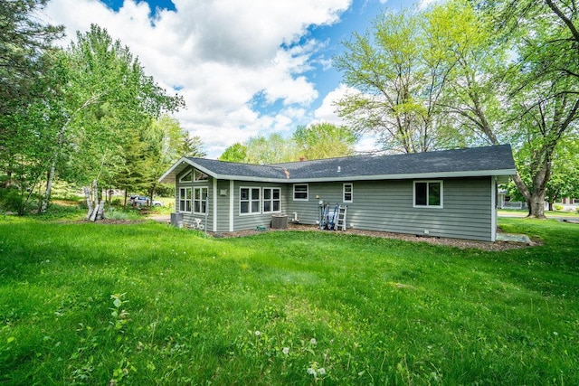903 Ingalls Rd, Menomonie, WI 54751 - rear view of house featuring a yard and central AC unit