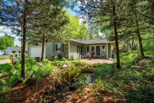 903 Ingalls Rd, Menomonie, WI 54751 - view of front of property with a garage and a patio