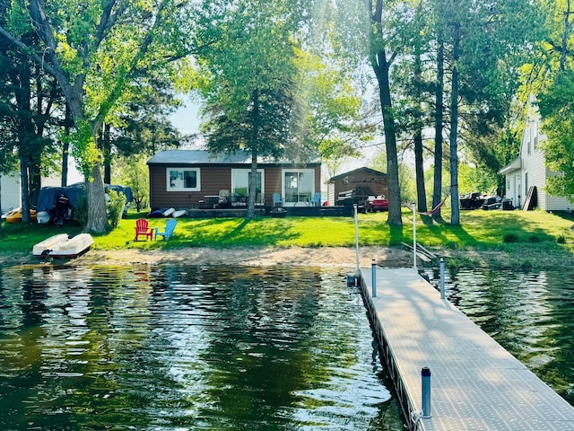 22535 Gateway Dr, Leslie Twp, MN 56360 - dock with a water view and a yard