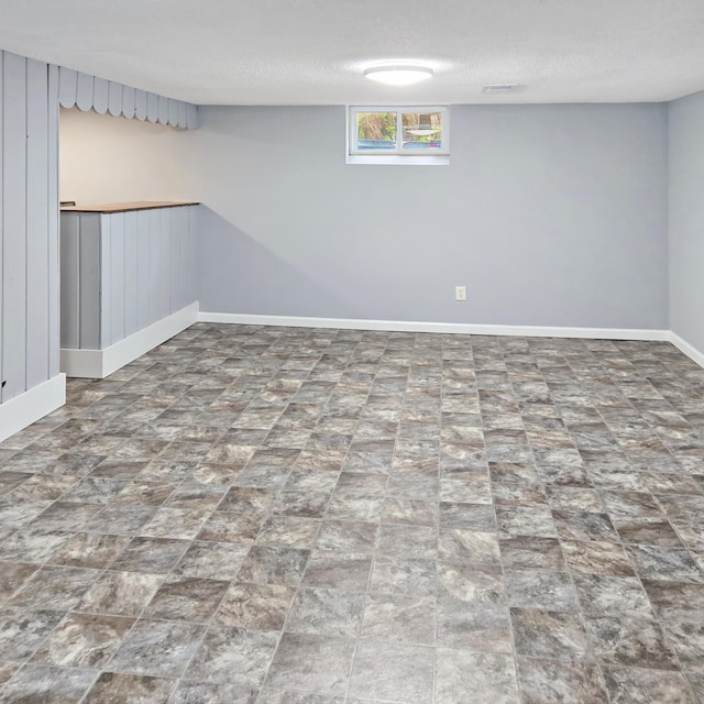 2718 Morgan Ave N, Minneapolis, MN 55411 - below grade area featuring baseboards and a textured ceiling
