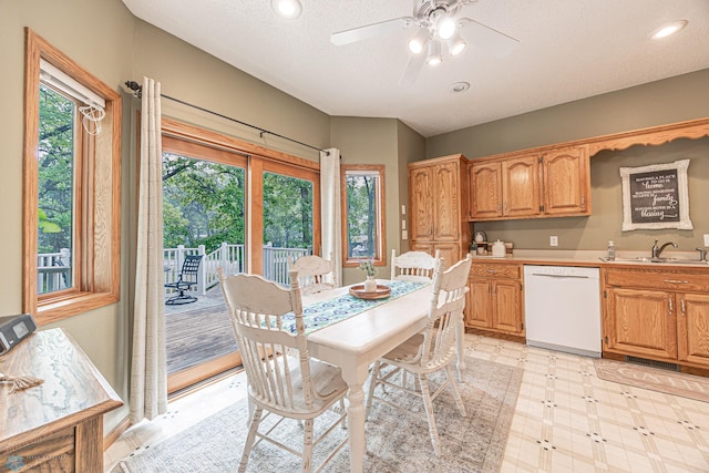 5916 Elm St N, Moorhead, MN 56560 - dining space with light flooring, a ceiling fan, and a textured ceiling