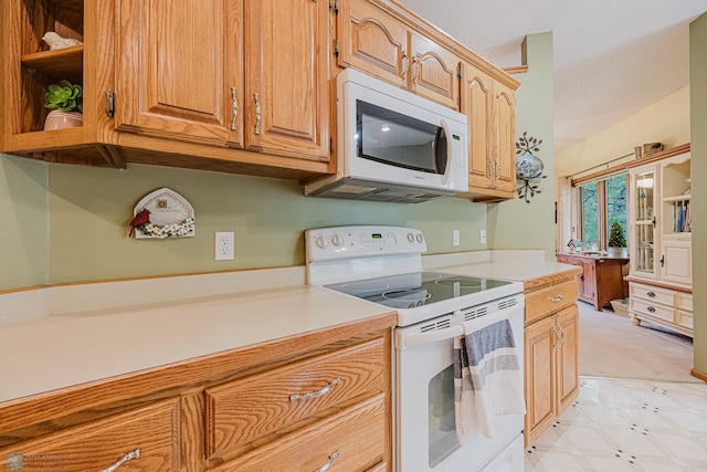 5916 Elm St N, Moorhead, MN 56560 - kitchen with white appliances, light countertops, brown cabinets, and open shelves