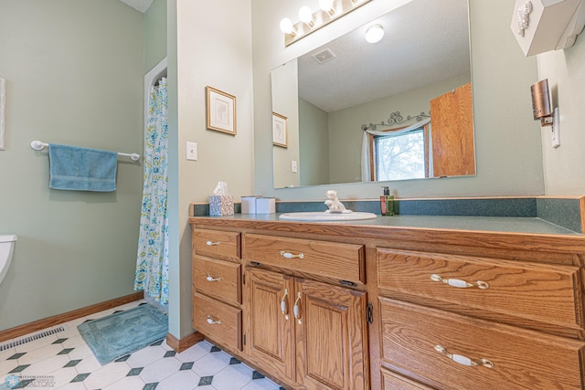 5916 Elm St N, Moorhead, MN 56560 - full bath featuring vanity, baseboards, and toilet