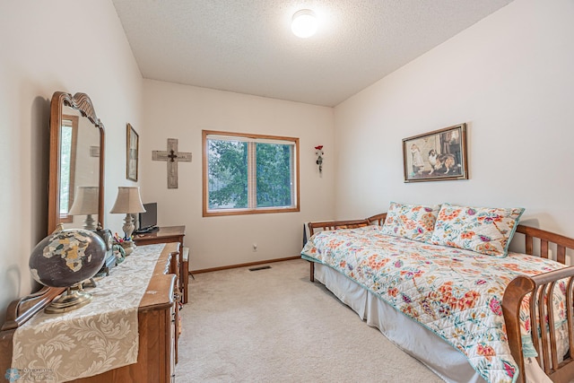 5916 Elm St N, Moorhead, MN 56560 - bedroom with light carpet, baseboards, and a textured ceiling