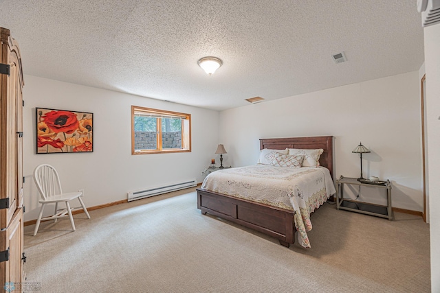 5916 Elm St N, Moorhead, MN 56560 - carpeted bedroom with a baseboard radiator, baseboards, and a textured ceiling