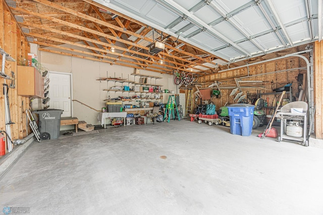 5916 Elm St N, Moorhead, MN 56560 - garage with a garage door opener and a workshop area