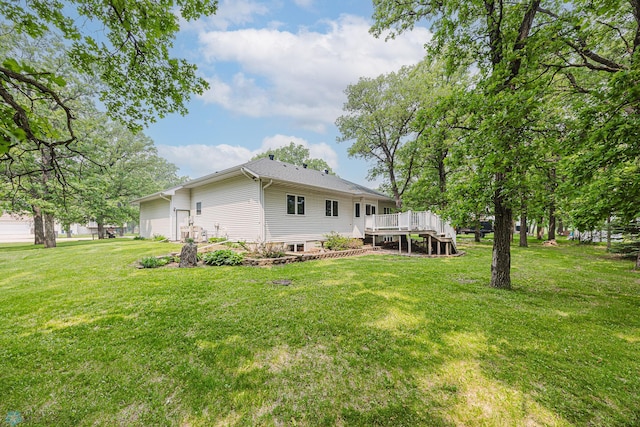 5916 Elm St N, Moorhead, MN 56560 - rear view of property with a deck and a yard