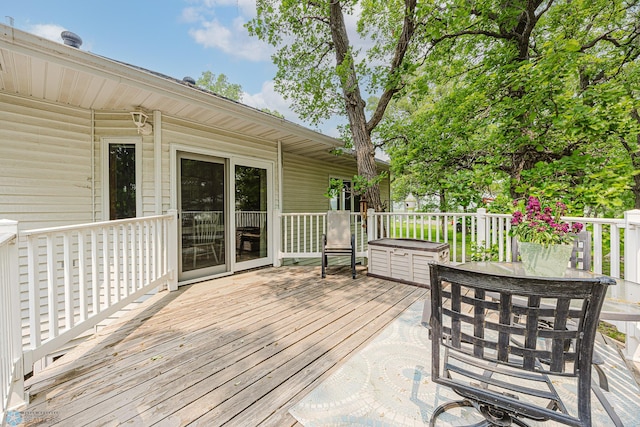 5916 Elm St N, Moorhead, MN 56560 - wooden deck featuring outdoor dining space