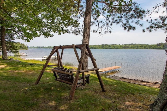 1378 Sunflower Trl NE, Outing, MN 56662 - dock with a water view and a lawn