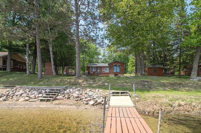 1378 Sunflower Trl NE, Outing, MN 56662 - rear view of property with a yard and an outdoor structure