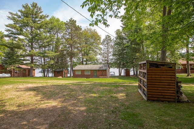 1378 Sunflower Trl NE, Outing, MN 56662 - view of grassy yard featuring an outdoor structure