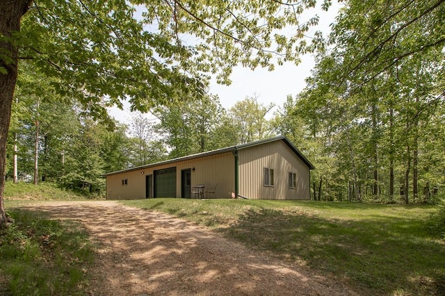 1378 Sunflower Trl NE, Outing, MN 56662 - view of pole building featuring driveway